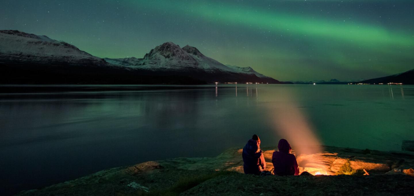 Northern lights by a beach in the Tromso region