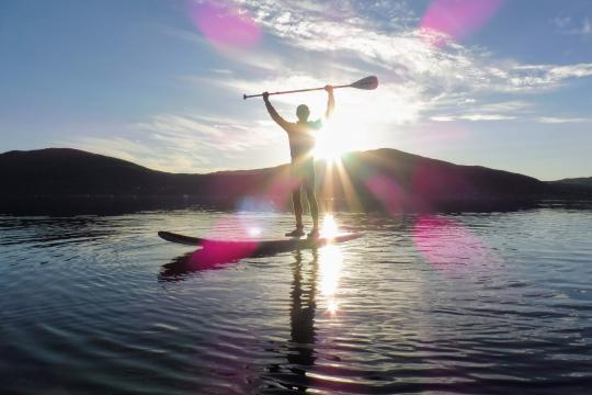 Person enjoying stand up paddling