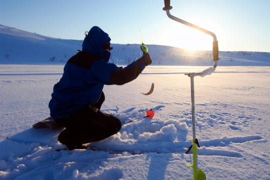 person ice fishing