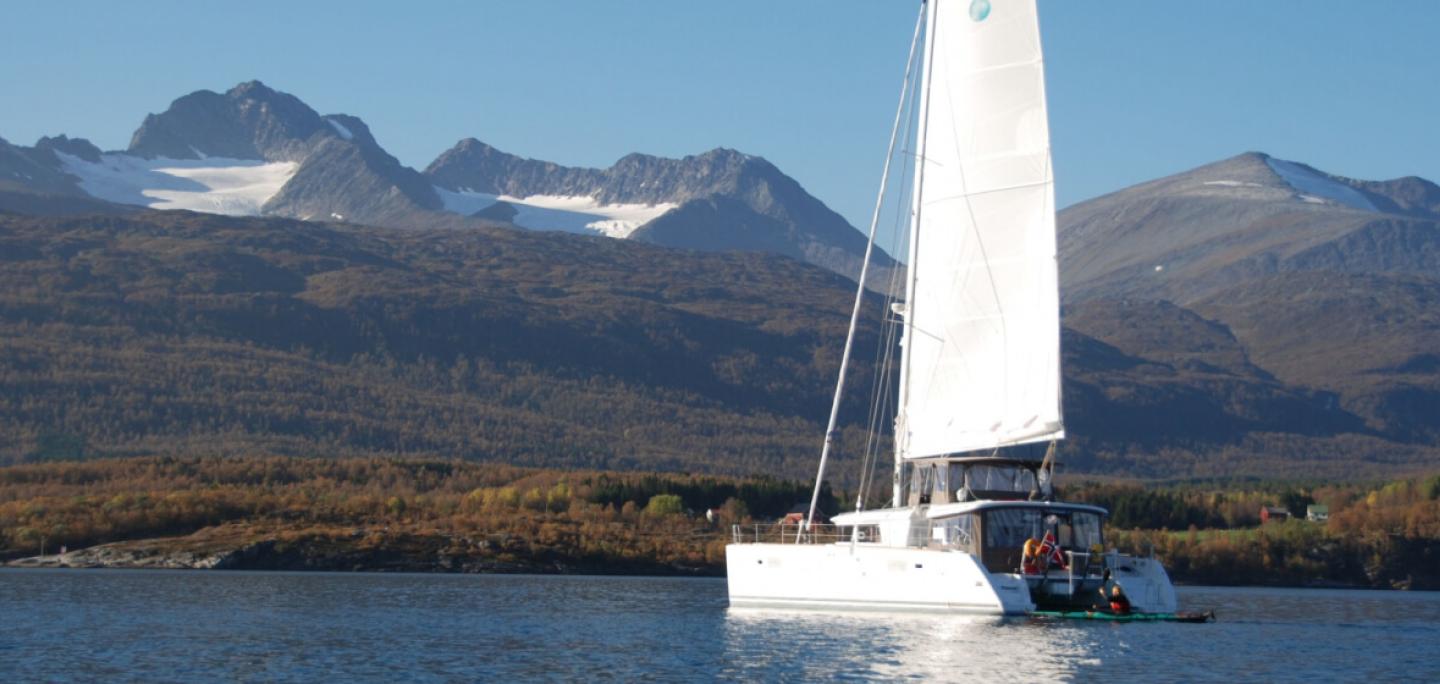 The catamaran Arctic Princess sailing in a fjord