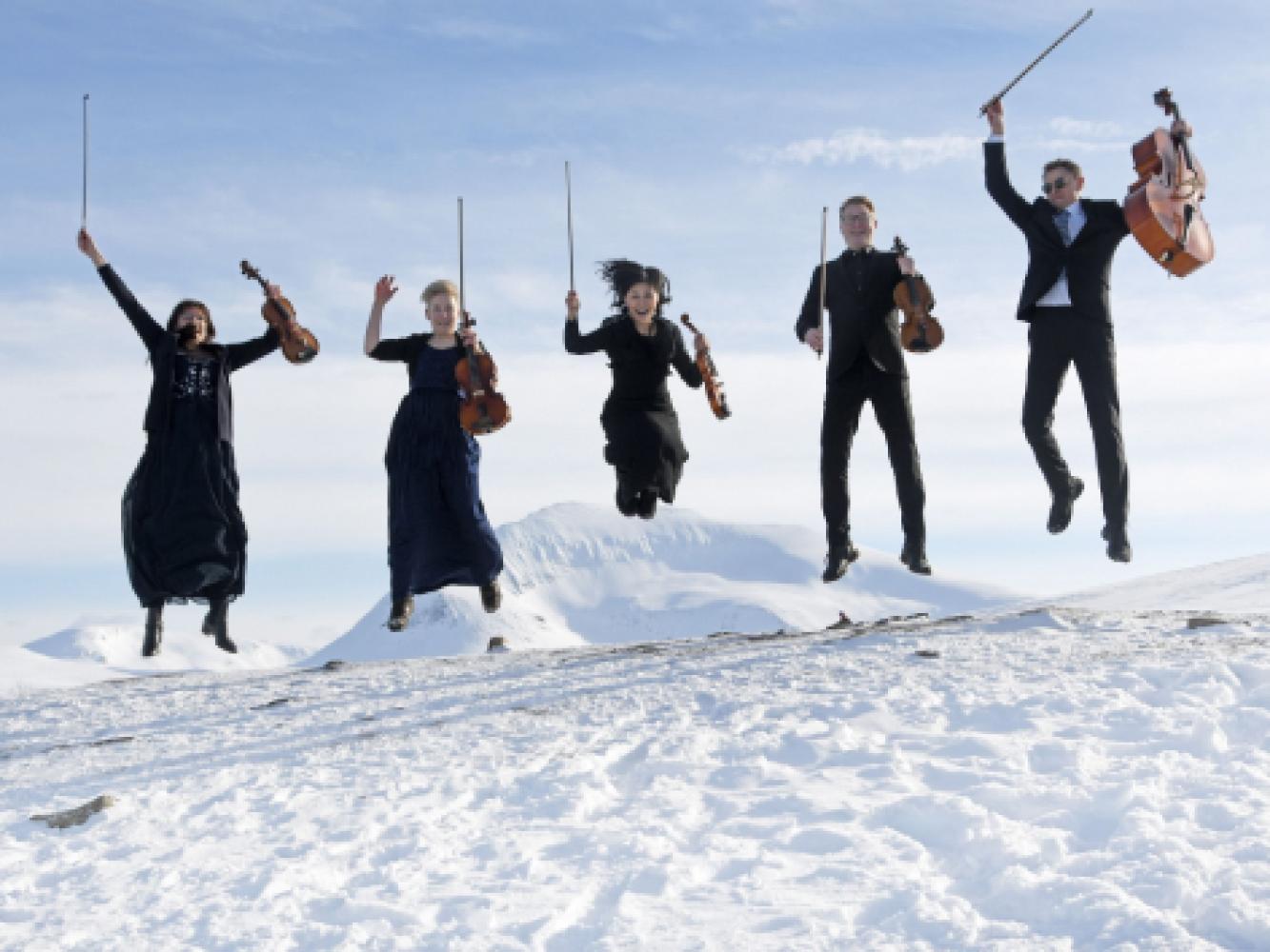 Musicians jumping in the snow in Tromsø