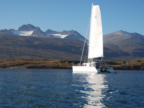 the catamaran Arctic Princess sailing in a fjord