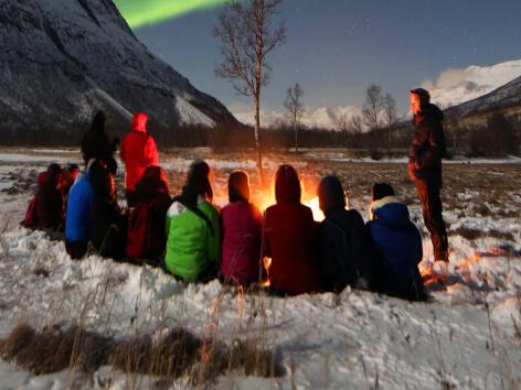 small group watching the northern lights